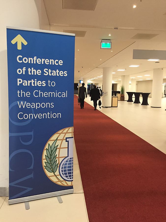 A sign points the way for delegates to the Chemical Weapons Convention conference sessions at The Hague in November 2018. (Photo: Alicia Sanders-Zakre/Arms Control Association)