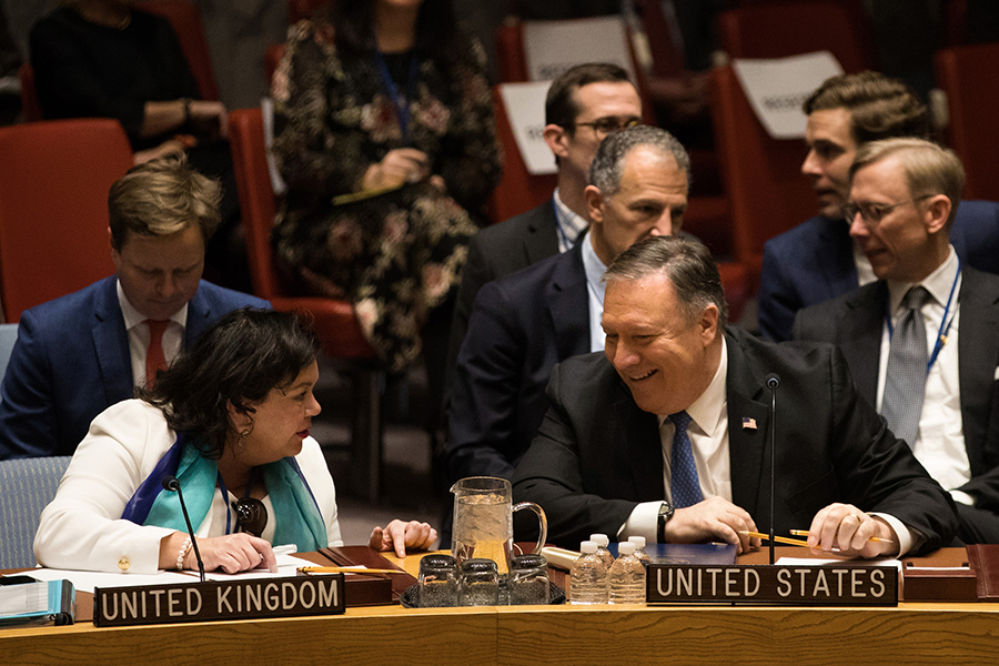 U.S. Secretary of State Mike Pompeo chats with Karen Pierce, UK permanent representative of to the UN, during the Security Council meeting on Iran held December 12, 2018. (Photo: Kevin Hagen/Getty Images)