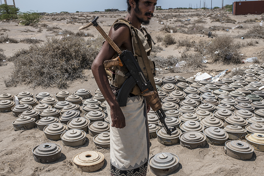 A fighter with Yemen’s Tariq Salah forces, a militia aligned with the Saudi-backed government, shows landmines reportedly found in September at an outpost of the Houthi rebels.  (Photo: Andrew Renneisen/Getty Images)