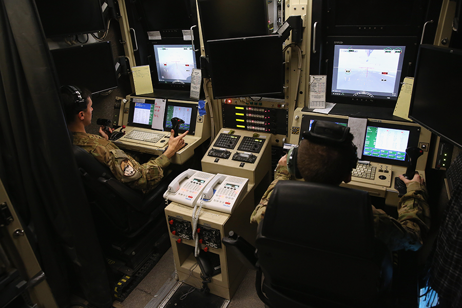 A U.S. Air Force crew operates a Predator drone from a Middle Eastern air base.  The Defense Department is seeking to use artificial intelligence to analyze drone-collected imagery. (Photo: John Moore/Getty Images)