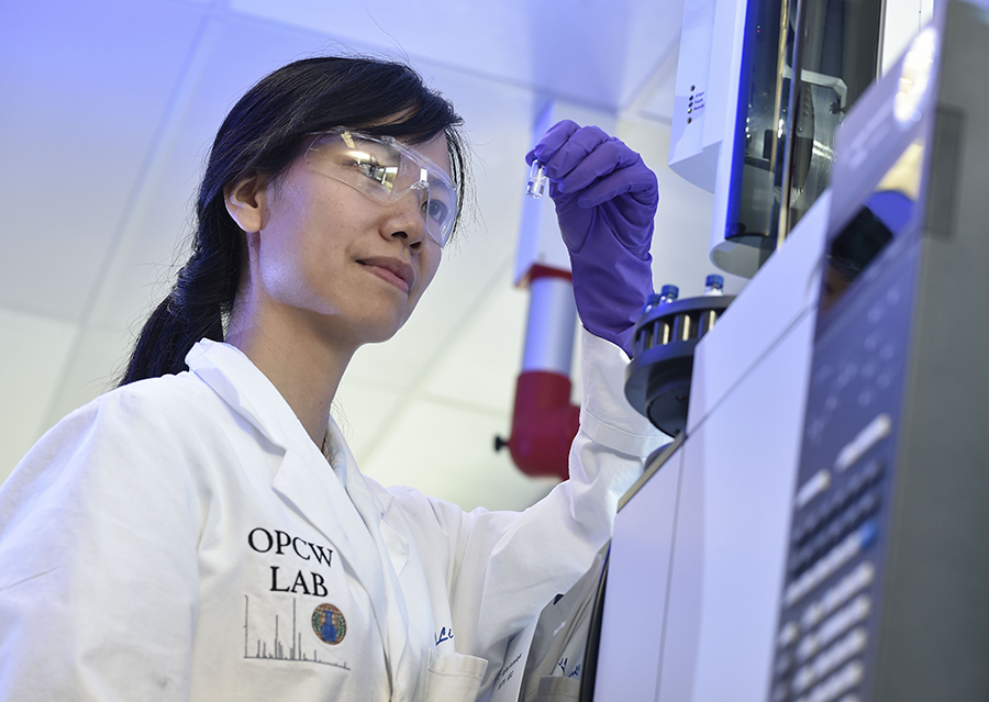 A laboratory technician examines a test vial at an OPCW laboratory near the Hague in 2017.  The agency has determined that an April 2018 attack in Syria used chlorine-based weapons.  (Photo: John Thys/AFP/Getty Images)