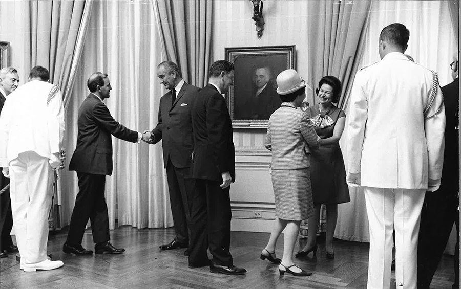 Lawrence Weiler (left) is greeted by President Lyndon Johnson and Lady Bird Johnson (right) at a 1968 reception. (Photo courtesy of Weiler family.)