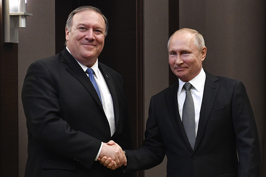 U.S. Secretary of State Mike Pompeo (left) greets Russian President Vladimir Putin in Sochi on May 14. The two agreed that the United States and Russia will hold meetings to discuss a broad range of arms control issues. (Photo: Alexander Nemenov/AFP/Getty Images)