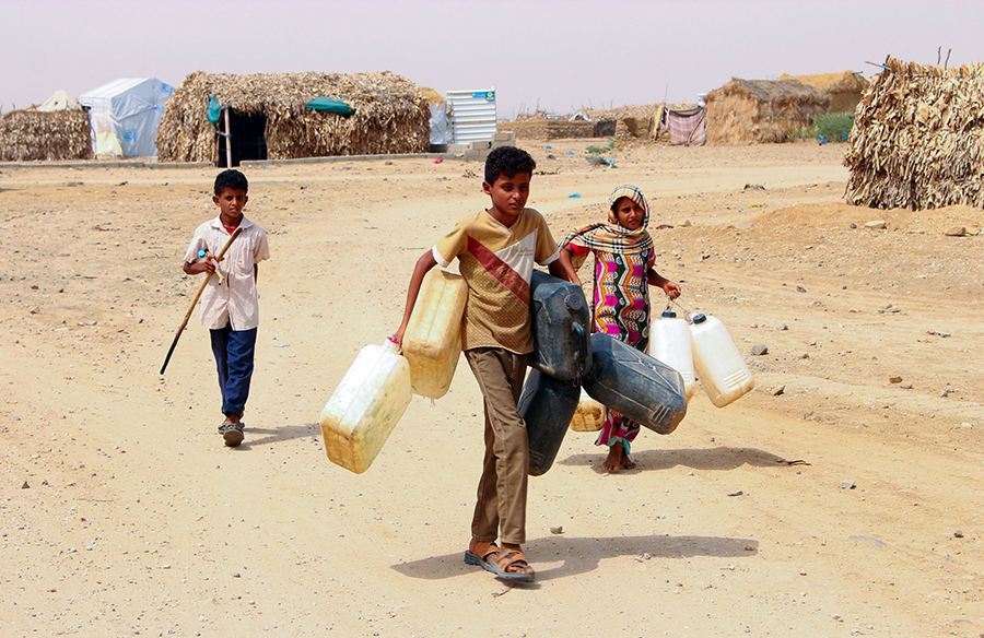 Displaced Yemeni children carry water containers at a camp in the country's Hajjah province on June 23. The U.S. Senate voted June 20 to halt $8.1 billion of arms sales to Saudi Arabia and its partners in the conflict in Yemen. (Photo: Essa Ahmed/AFP/Getty Images)