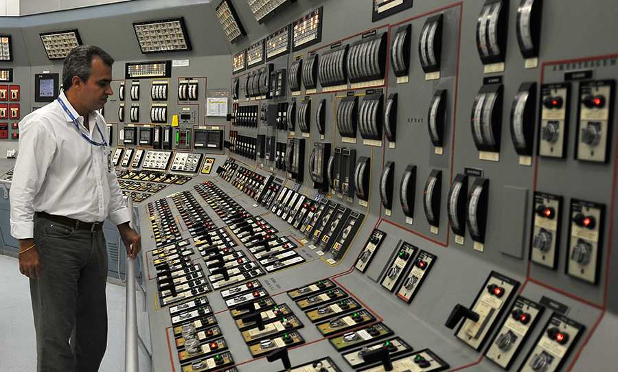 A technician examines the control room of Brazil's Angra 1 nuclear power plant in 2011. Efforts to build a third nuclear plant have stalled following a corruption scandal at the nation's state-run nuclear company. (Photo: Vanderlei Almeida/AFP/Getty Images)