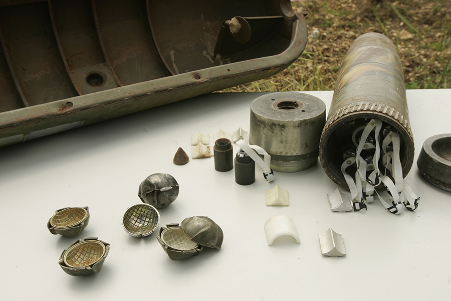 Components of a cluster munition are displayed at a UN peacekeeper camp in 2007. The cluster munitions treaty will hold its second review conference in 2020, 10 years after its entry into force. (Photo by Mark Renders/Getty Images)