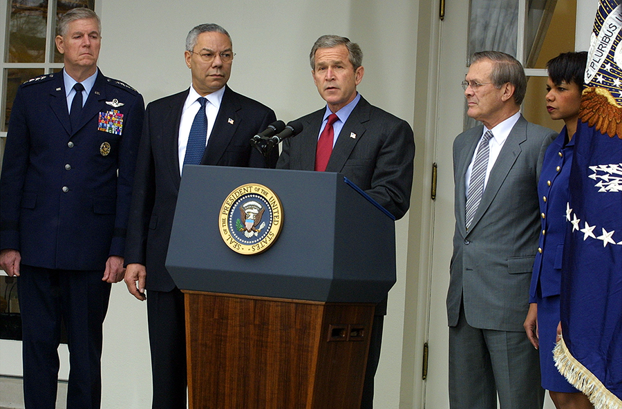 Flanked by his top national security advisers on December 13, 2001, President George W. Bush announces the U.S. intention to withdraw from the ABM Treaty.  Treaty-related talks were underway in Geneva at the time, and U.S. representatives received word of the decision only hours before the announcement. (Photo: Alex Wong/Getty Images)