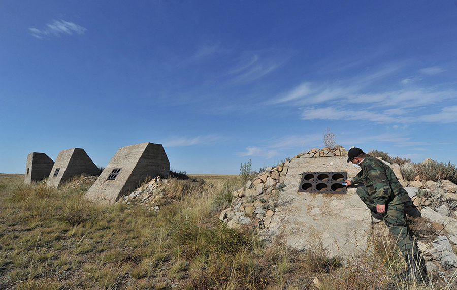 A specialist examines the remnants of nuclear test measurement facilities at the Semipalatinsk test site in Kazakhstan in 2011. Kazakh anti-nuclear activists built public pressure to end Soviet testing in the 1980s, enabling U.S. and Soviet leaders to begin negotiating a global ban on tests. (Photo: Vyacheslav Oseledko/AFP/Getty Images)