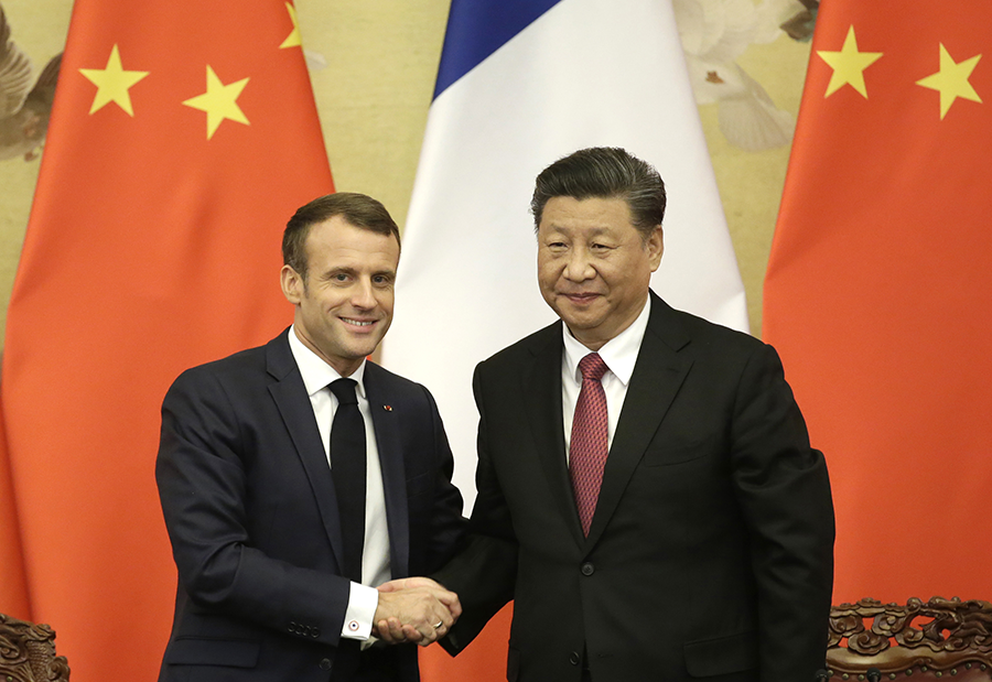 President Emmanuel Macron greets Chinese President Xi Jinping in Beijing on Nov. 6, 2019. The two set a Jan. 31 deadline to identify a site to build a French nuclear fuel reprocessing in China, but no announcement has been made so far.  (Photo: Jason Lee/Pool/Getty Images)