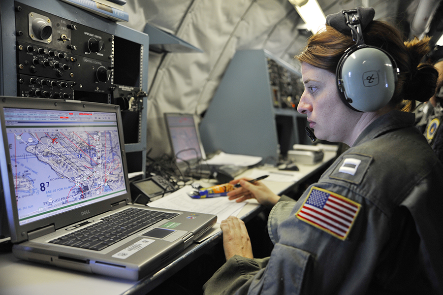 Navy Lt. Bethany Baker monitors the path of an OC-135B aircraft during a January 2016 flight over Haiti unrelated to the Open Skies Treaty. The Pentagon has elected not to upgrade the aircraft as the Trump administration assesses the U.S. role in the Treaty. (Photo: Perry Aston/U.S. Air Force)