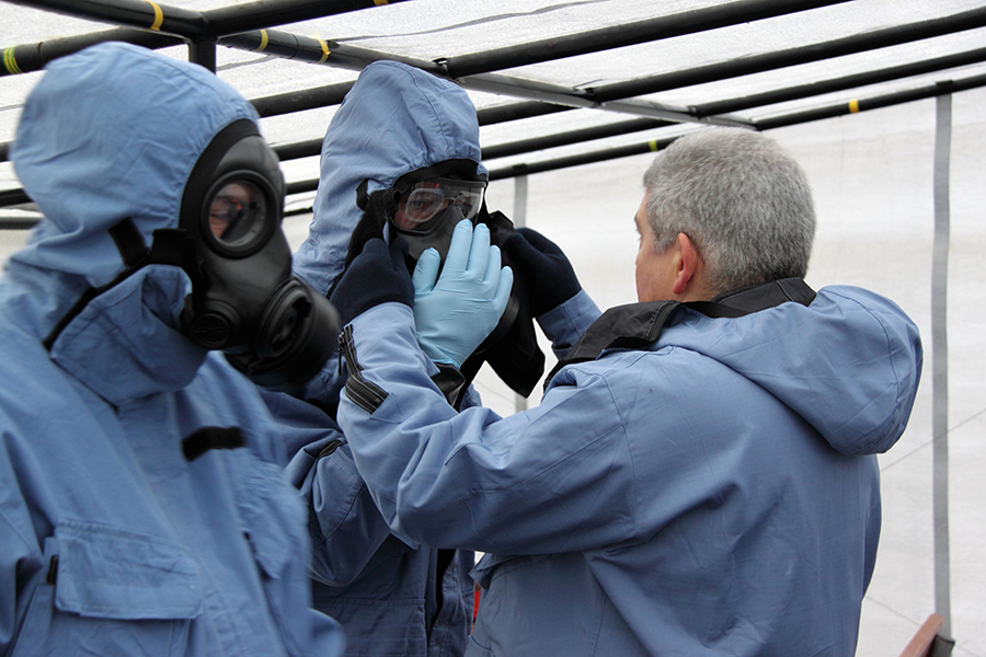 OPCW inspectors have their equipment checked during a 2009 training session in the Czech Republic.  The OPCW is uniquely qualified to support nations in their efforts to discover and destroy old chemical weapons. (Photo: OPCW)