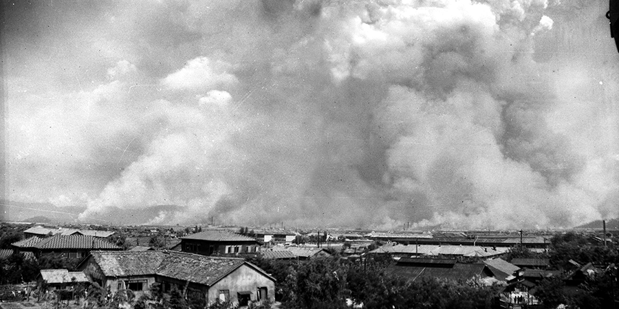 The city of Hiroshima on fire on August 6, as seen from four kilometers away. A firestorm ravaged the city of Hiroshima for hours after the explosion, peaking around midday. Firestorms leveled neighborhoods where the blast had inflicted only partial damage and killed victims trapped under fallen debris. Within 20 minutes, the explosion also produced black rain laden with radioactive soot and dust that contaminated areas as far away as 29 kilometers from ground zero. (Photo: Hiroshima Peace Memorial Museum)