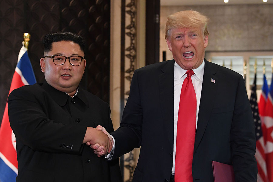 North Korea's leader Kim Jong Un congratulates U.S. President Donald Trump after a signing ceremony at their Singapore summit on June 12, 2018. Any goodwill generated there appears to have evaporated with the latest remarks by North Korean officials on the second anniversary of the meeting. (Photo: Saul Loeb/AFP/Getty Images)