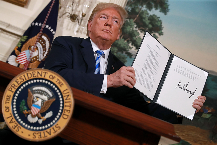 U.S. President Donald Trump displays his order reinstating sanctions on Iran after he announced his decision to withdraw the United States from the 2015 Iran nuclear deal in the Diplomatic Room at the White House on May 8, 2018.  (Photo: Chip Somodevilla/Getty Images)