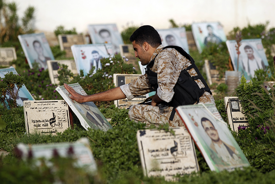 A Yemeni man visits a cemetery in Sanaa in 2017, on the morning of the first day of Eid al-Adha. The Arms Trade Treaty aims to reduce the illicit transfer of conventional weapons, which can fuel conflicts which cause the most casualties among civilians.  (Photo: Mohammed Huwais/AFP/Getty Images)