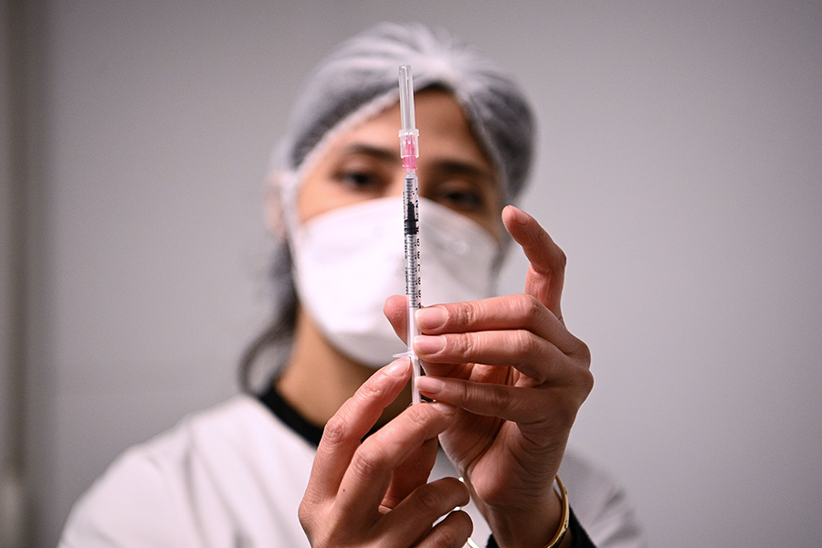 A health worker prepares a syringe of Covid-19 vaccine on Jan. 6 in France. The pandemic illustrates the danger of intentional biological attacks and the need to prevent them. (Photo: Christophe Archambault/AFP/Getty Images)