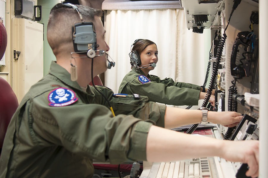 A pair of U.S. Air Force missile combat crew commanders simulate key turns of the Minuteman III intercontinental ballistic missile weapon system at F.E. Warren Air Force Base, Wyo., February 9, 2016. U.S. ICBMs are currently ready for launch on warning within minutes of an order authorized by the president. (U.S. Air Force photo by Senior Airman Jason Wiese.)