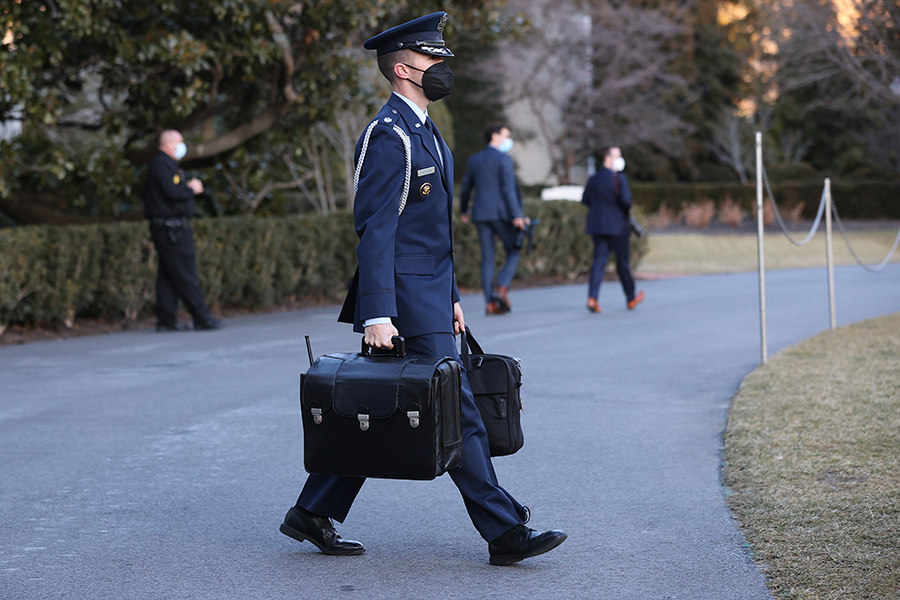 An Air Force aide carries the ‘nuclear football’ out of the White House as he accompanies U.S. President Joe Biden to Delaware for the weekend on February 5, in Washington, DC. (Photo: Chip Somodevilla/Getty Images)