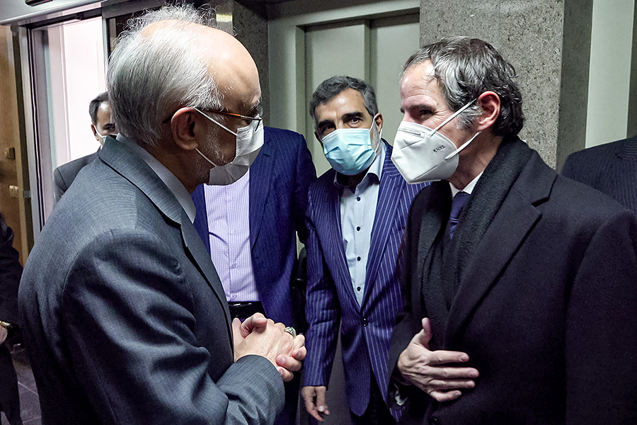 The head of the Atomic Energy Organisation of Iran, Ali Akbar Salehi (L), meeting with the visiting Director General of the International Atomic Energy Agency Rafael Grossi (R), in Tehran. In response to the U.S. withdrawal from the JCPOA in 2018, Iran  has accelerated its nuclear activities. The most recent IAEA report finds that Iran’s enriched uranium stockpile is 14 times above  the JCPOA limit and it is not enriching uranium to 20 percent instead of the 3.67 percent permitted under the deal.  (Photo: POOL/AFP via Getty Images)