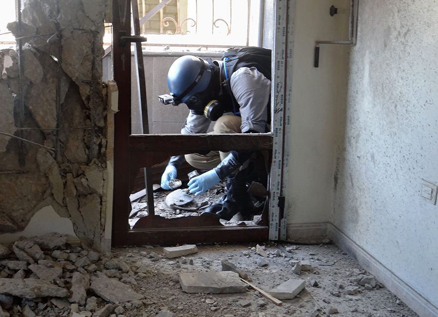 A UN-OPCW inspector collects samples on August 29, 2013 where rockets armed with Sarin struck Damascus' eastern Ghouta suburb. The findings helped push Syria to join the CWC and allow for the removal and destruction of the bulk of its deadly chemical weapons stockpile. Since then, chemical attacks resumed and Syria has failed to address lingering questions about the accuracy of its chemical weapons stockpile declaration.  (Photo: Ammar Al-Arbini/AFP via Getty Images)