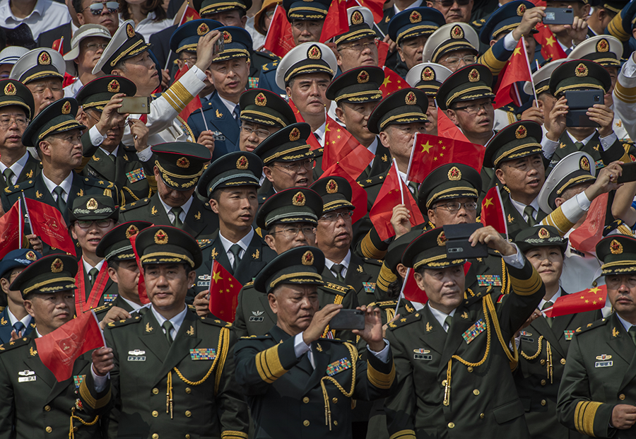 Chinese military officers, shown here at a 2019 parade in Beijing, operate under a doctrine that assumes conventional forces, not nuclear forces, win wars, author Gerald Brown writes. (Photo: Kevin Frayer/Getty Images)
