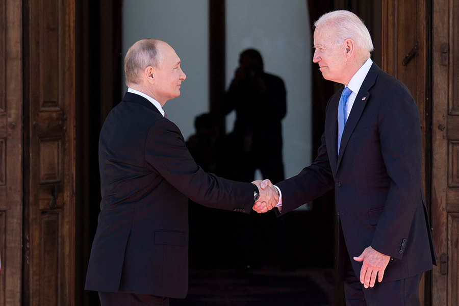 Russian President Vladimir Putin (L) shakes hands with U.S. President Joe Biden prior to the US-Russia summit at the Villa La Grange, in Geneva on June 16, 2021. (Photo by Brendan Smialowski/AFP via Getty Images)