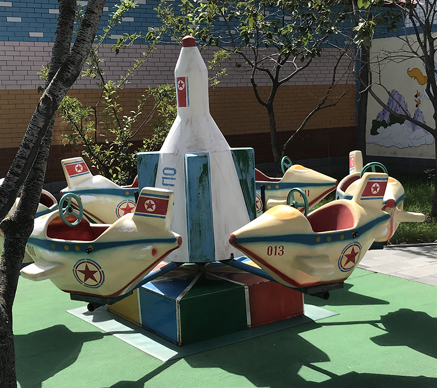 Nursery school playground with a rocket-themed ride in Pyongyang. From a very young age, North Koreans are taught about the country's military capabilities and the need to fear the United States. (Photo by Carol Giacomo, 2017)