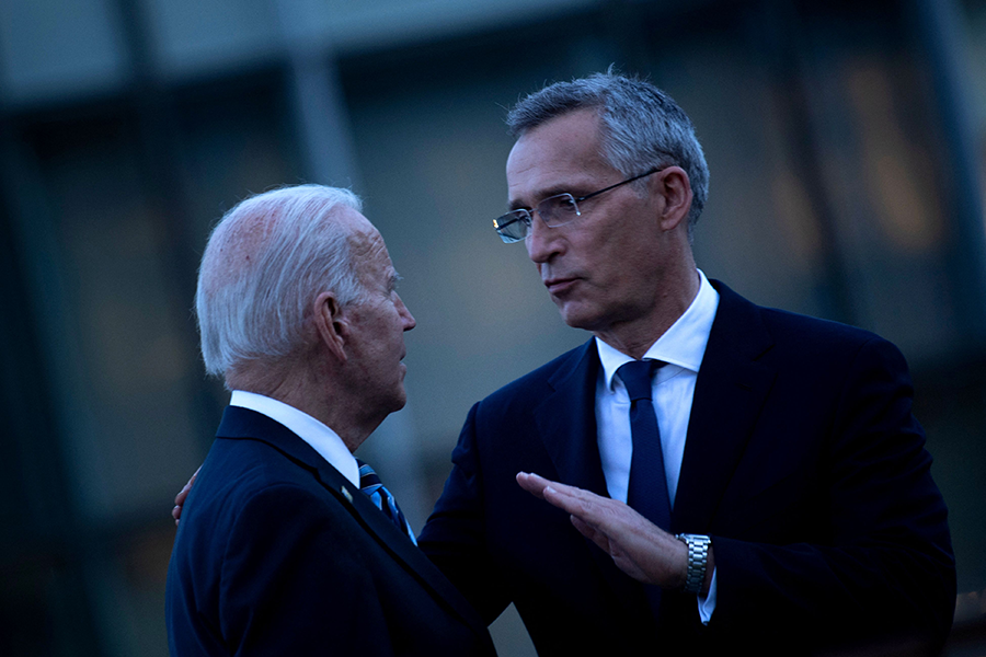 U.S. President Joe Biden and NATO Secretary General Jens Stoltenberg (R) talk at a memorial for the September 11 terrorist attacks on the United States after the June 14 NATO summit in Brussels. (Photo by Brendan Smialowski/AFP via Getty Images)