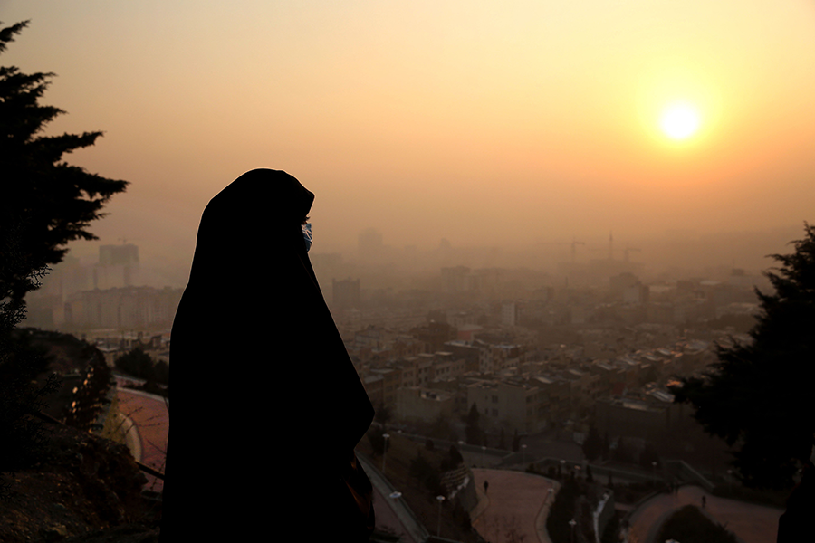 Smog, like this hazes engulfing Tehran in January 2021, is another climate threat facing Iran that could lend itself to regional remedies. (Photo by Atta Kenare/AFP via Getty Images)