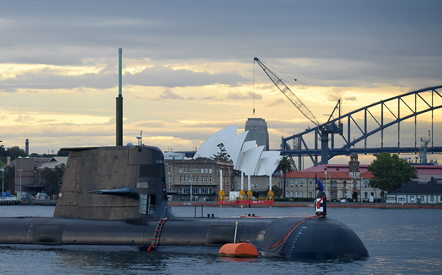 A Royal Australian Navy diesel and electric-powered Collins Class submarine sits in Sydney Harbour in 2016. That naval weapon is to be replaced by nuclear-powered submarines that the United Kingdom and the United States recently agreed to provide Australia as part of the new AUKUS defense cooperation announcement. (Photo by Peter Parks/AFP via Getty Images)
