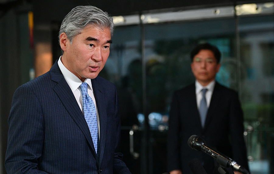 U.S. Special Representative for North Korea Policy Sung Kim (L) speaks to reporters outside of the State Department in Washington on October 18 as his South Korean counterpart, Noh Kyu-duk (R), looks on. (Photo by Mandel Ngan/AFP via Getty Images)