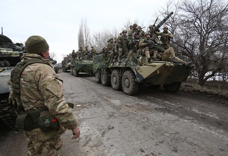 Ukrainian soldiers prepare to repel an attack in the breakaway Luhansk region on February 24 after Russian President Vladimir Putin launched a full-scale invasion of Ukraine. (Photo by Anatolii Stepanov/AFP via Getty Images)
