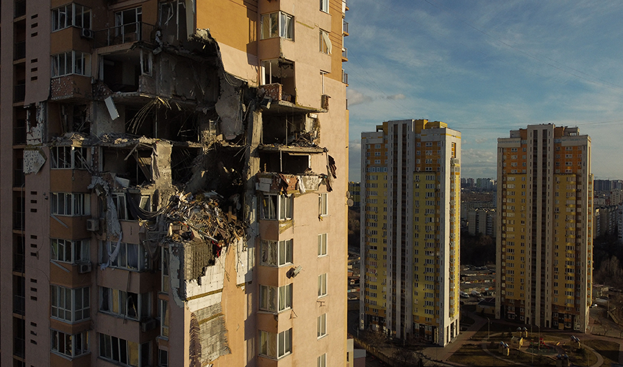 Damage to the upper floors of a high-rise building in Kyiv on Feb. 26 after it was reported to have been struck by a Russian rocket. (Photo by Daniel Leal/AFP via Getty Images)