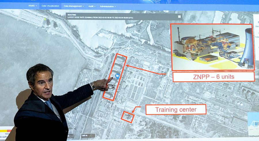 Rafael Mariano Grossi, director-general of the International Atomic Energy Agency, uses a diagram of the Zaporizhzhya nuclear power plant as a reference point as he talks to journalists in Vienna on March 4 about the situation at the Ukrainian nuclear power plants that have been put at risk by Russia's war in Ukraine. (Photo by Joe Klamar/AFP via Getty Images)