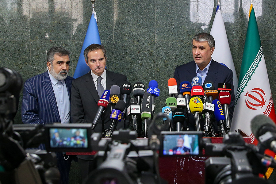 Rafael Mariano Grossi (C), head of the International Atomic Energy Agency and Mohammad Eslami (R), head of Iran's Atomic Energy Organization, hold a press conference during Grossi’s visit to Tehran on March 5.  (Photo by Amid Farahi/ISNA/AFP via Getty Images)