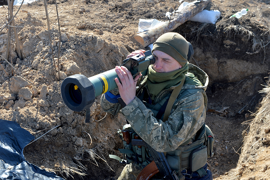 A Ukrainian serviceman aims a FGM-148 Javelin, a U.S.-made portable anti-tank missile, at a checkpoint near Kharkiv in March 2022. President Joe Biden is proposing billions more dollars in U.S. defense spending to meet the military and humanitarian needs of Ukraine as it tries to defend against a Russian onslaught. (Photo by Sergey Bobok/AFP via Getty Images)