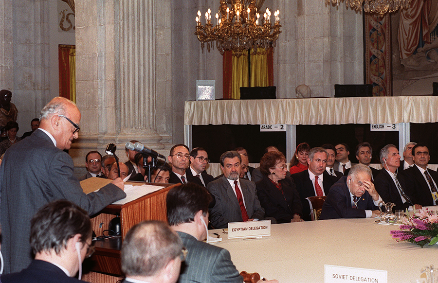 Haidar Abdel Shafi (L), head of the Palestinian delegation, addresses delegates to the Middle East Peace Conference in Madrid in October 1991. The conference launched multilateral negotiations on arms control, security, water, refugees, the environment and economic development. (Photo by Patrick Baz/AFP via Getty Images)