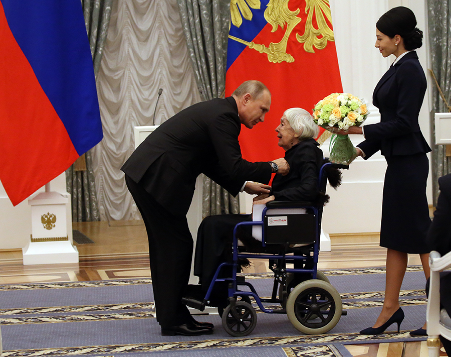 Five years ago, Russian President Vladimir Putin presented a major Russian human rights award to Lyudmila Alexeyeva (C), a leading human rights activist and member of the Helsinki Watch group. Since Russian forces invaded Ukraine, Putin has cracked down on civil society, including closing the office of Human Right Watch and other activist groups who have operated in Russia for years. (Photo by Mikhail Svetlov/Getty Images)