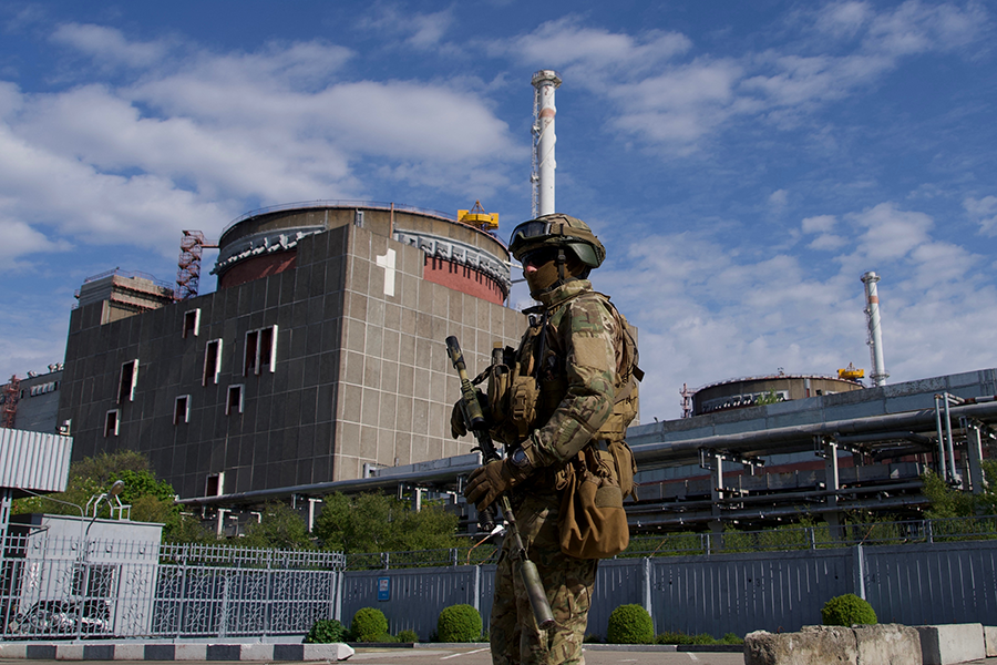 A Russian soldier patrols the territory of the Zaporizhzhya Nuclear Power Station in southeastern Ukraine on May 1, 2022. It is the largest nuclear power plant in Europe. The photo was shot during a media tour organized by the Russian army.  (Photo by Andrey Borodulin/AFP via Getty Images) 