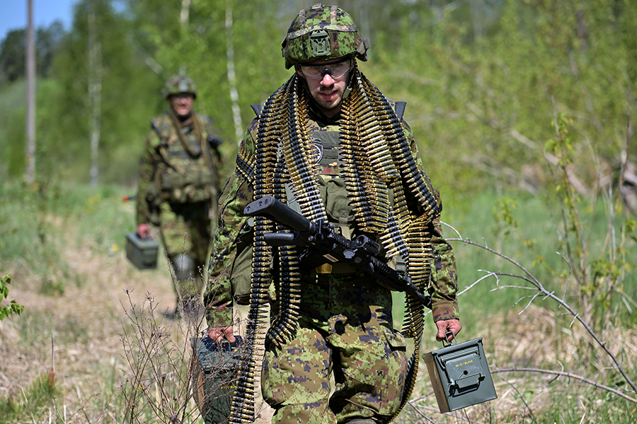 Reservists from the 2nd Estonian Infantry Brigade take part in maneuvers during a NATO exercise on the Estonian-Latvian border on May 25 in Voru, Estonia. Fifteen thousand troops from 14 countries are participating in one of the largest ever military exercises in the Baltics as NATO members funnel weapons and other assistance to Ukraine to beat back a Russian invasion. (Photo by Jeff J Mitchell/Getty Images)
