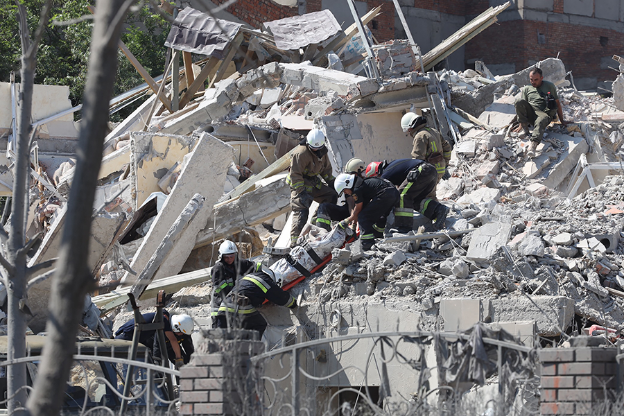 Although given security guarantees in 1994 when it gave up Soviet-era nuclear weapons on its territory, Ukraine today is in the fifth month of an unprovoked war by Russia that has killed thousands of civilians and destroyed countless cities. In photo, rescuers evacuate the body of a person from a building in Sergiyvka, near Odessa, that was hit by a missile strike on July 1, according to the Ukrainian emergency services. (Photo by Oleksandr Gimanov/AFP via Getty Images)