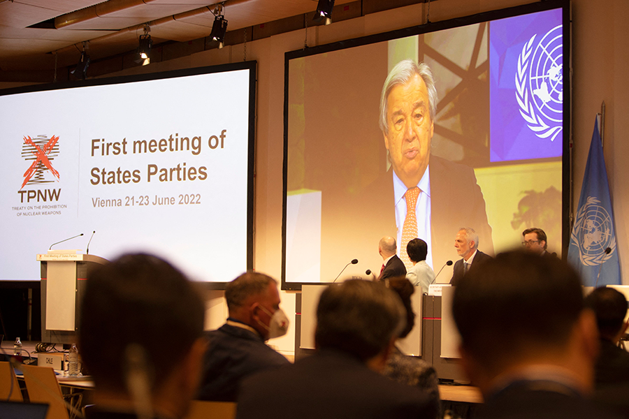 UN Secretary-General António Guterres (on screen) speaks during First Meeting of States-Parties to the Treaty on the Prohibition of Nuclear Weapons (TPNW) in Vienna on June 21. The treaty, which bans nuclear weapons, has been ratified by 66 countries. Notable holdouts are the United States and other nuclear-weapon states.  (Photo by Alex Halada/AFP via Getty Images)