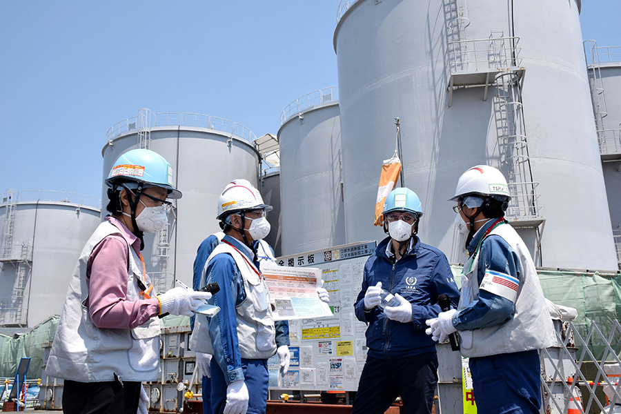 Director-General of the International Atomic Energy Agency Rafael Mariano Grossi  (2nd from the right) visited Japan's Fukushima Daiichi nuclear power plant in May. Japan has an advanced civilian nuclear energy program that could shift to weapons uses if the United States did not guarantee Japan's security.  (Photo by STR/JAPAN POOL / JIJI PRESS/AFP via Getty Images)