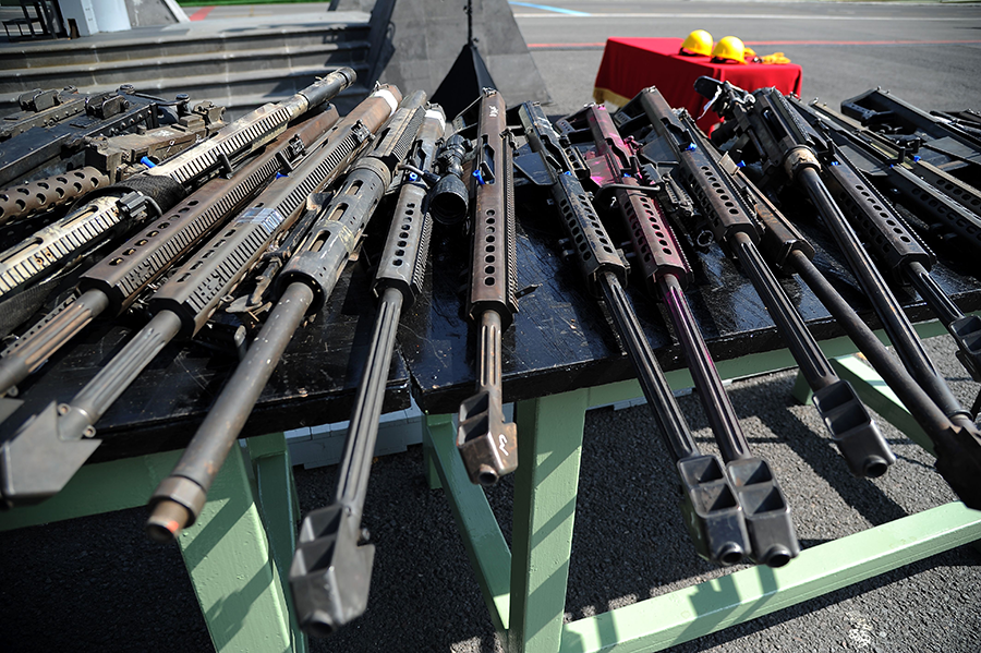 This cache of .50 caliber rifles, which were seized from criminals or voluntarily handed over to Mexican authorities, was destroyed at Military Camp 1-A in Mexico City in August 2017. According to data from the Mexican Defense Ministry, from July 24 to July 31 that year, a total of 17,769 firearms were destroyed at various military camps around the country. (Photo by Bernardo Montoya/AFP via Getty Images)