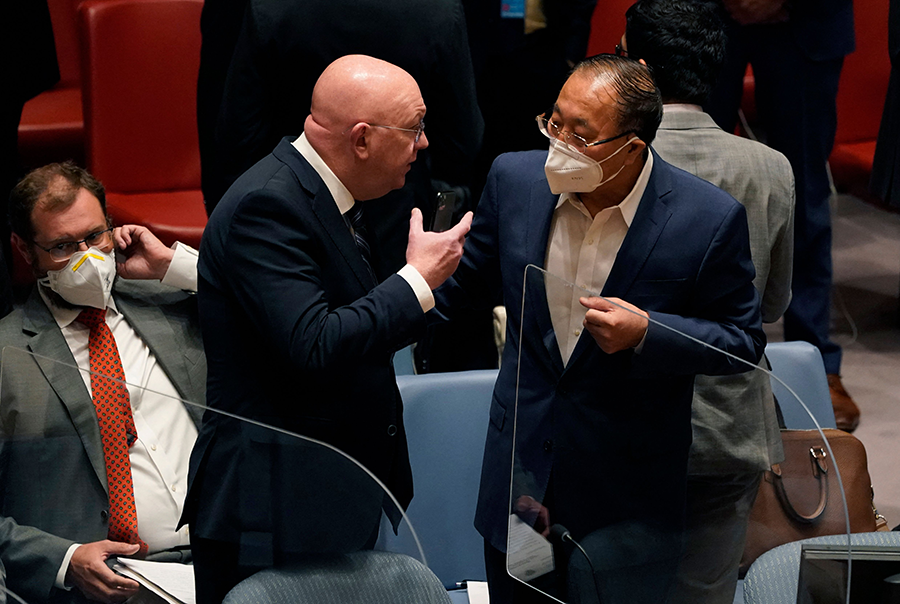 Russian Ambassador to the UN Vasily Nebenzya (L) and Chinese Ambassador to the UN Zhang Jun confer at a UN Security Council meeting on August 24. During that meeting and the concurrent NPT review conference, Russia and Ukraine traded accusations about the nuclear security crisis engulfing the Zaporizhzhia nuclear power plant in Ukraine. (Photo by Timothy A. Clary/AFP via Getty Images)