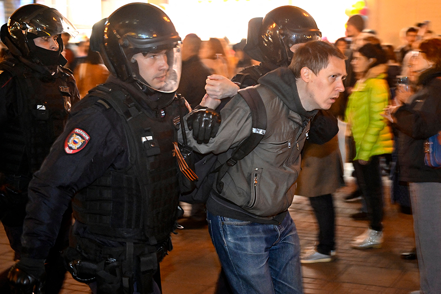 Police officers detain a man in Moscow on Sept. 21 during protests against the military mobilization of 300,000 men announced by Russian President Vladimir Putin as part of an effort to replenish forces deployed to fight Russia’s war on Ukraine. (Photo by Alexander Nemenov/AFP via Getty Images)