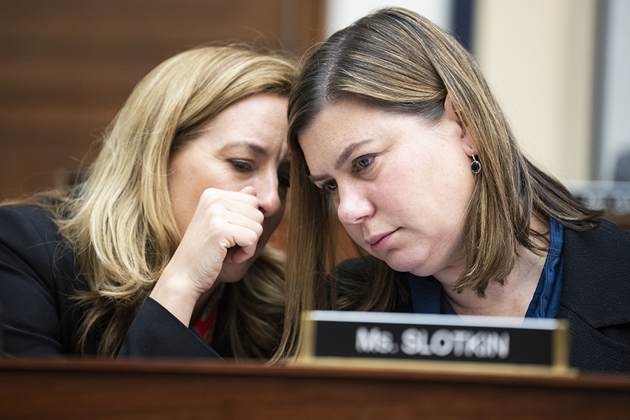 Rep. Mikie Sherrill (D-N.J.) (L) and Rep. Elissa Slotkin (D-Mich.) confer during a U.S. House Armed Services Committee hearing in April on the Biden administration’s fiscal year 2023 defense budget request. (Photo by Tom Williams/CQ-Roll Call, Inc via Getty Images)