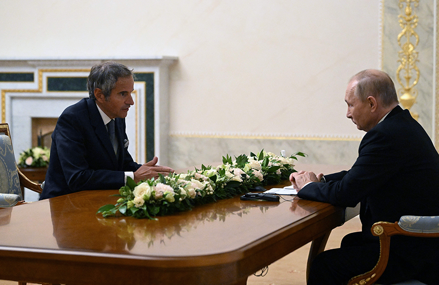 Rafael Mariano Grossi (L), director-general of the International Atomic Energy Agency, meets Russian President Vladimir Putin in St. Petersburg on Oct. 11 as part of his effort to secure support for a zone of protection around the Zaporizhzhia nuclear power plant. (Photo by Pavel Bednyakov/AFP via Getty Images)