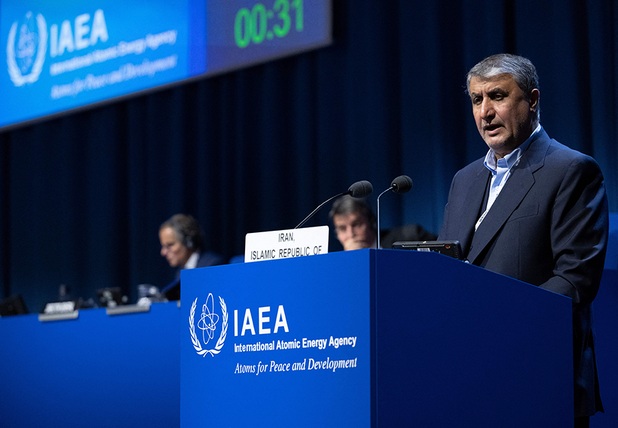 For decades, the International Atomic Energy Agency (IAEA) has been on the frontlines of preventing nuclear proliferation, including working to limit Iran's nuclear program and resolve Russian threats to nuclear power plants in Ukraine. Here, Iran’s nuclear chief, Mohammad Eslami, speaks during the agency’s general conference in Vienna in September. (Photo by Joe Klamar/AFP via Getty Images)
