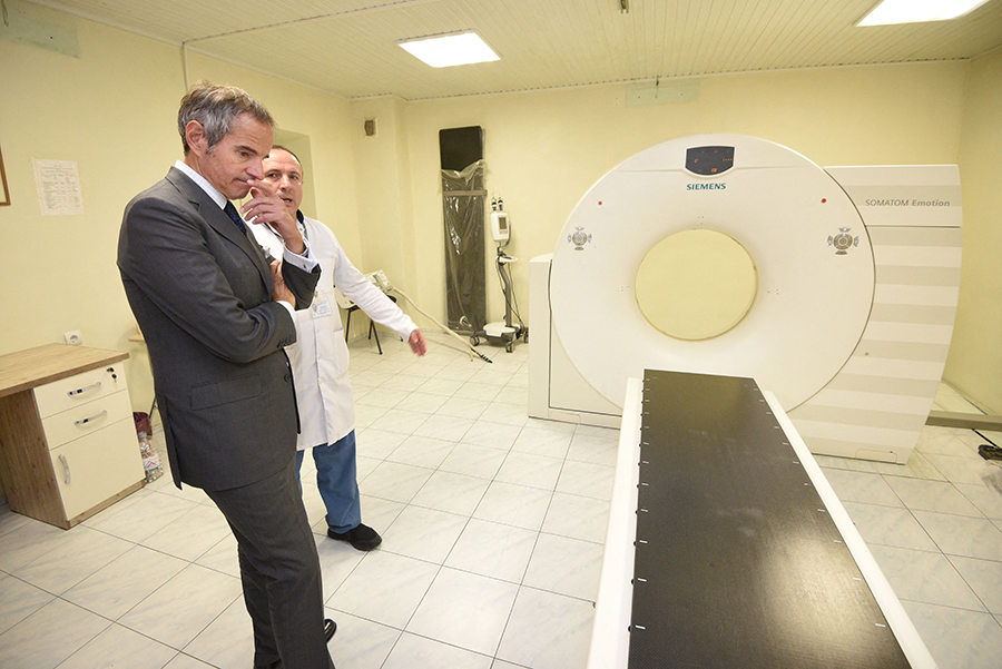 Although the International Atomic Energy Agency (IAEA) is best known for working to stem nuclear proliferation, it has a broad mandate that includes advancing the peaceful uses of nuclear technology. IAEA Director-General Rafael Mariano Grossi (L) in October visited Azerbaijan's National Center of Oncology, where the IAEA funded part of the hospital's medical equipment. (Photo by Karen Minasyan/AFP via Getty Images)